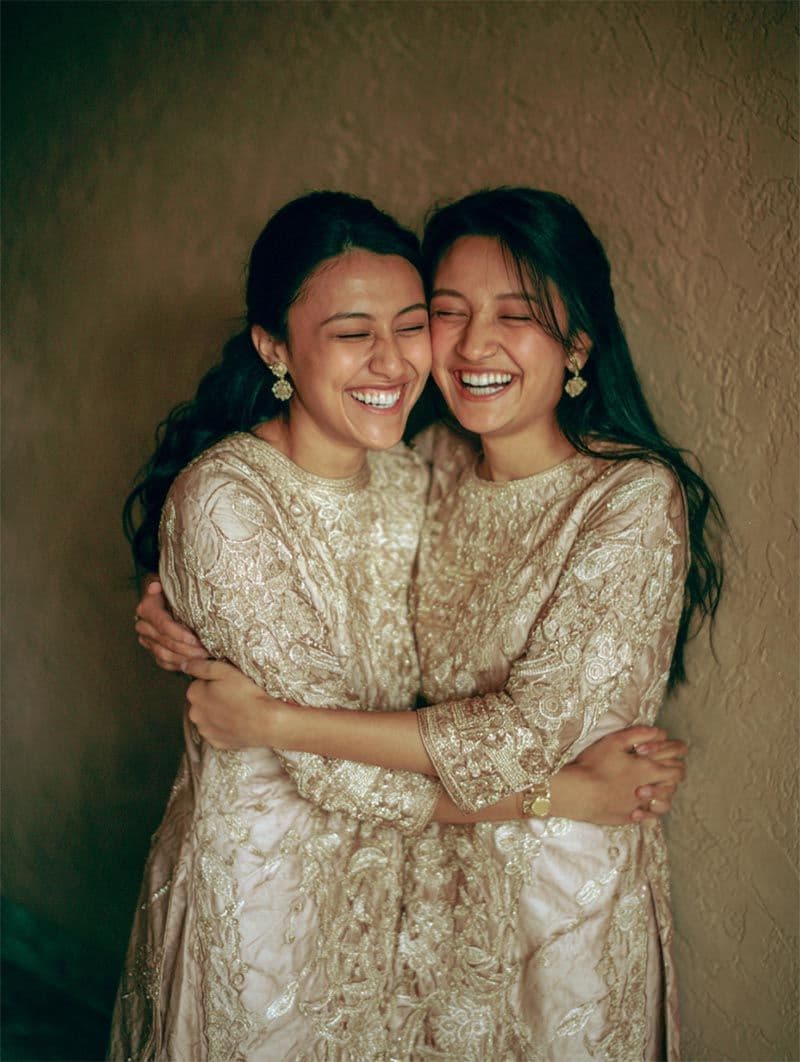 Bride embracing bridesmaid in a quiet wedding-morning moment, editorial Michigan luxury wedding
